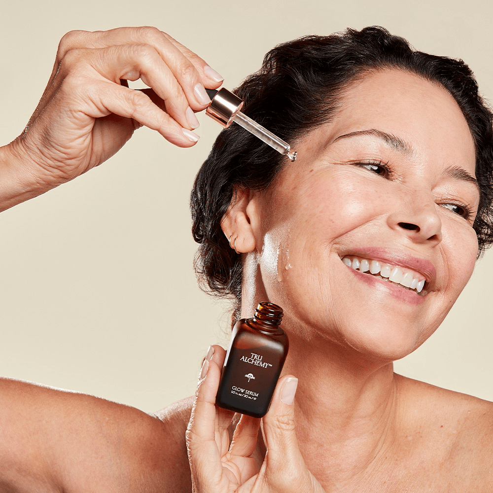 smiling woman using Tru Alchemy&