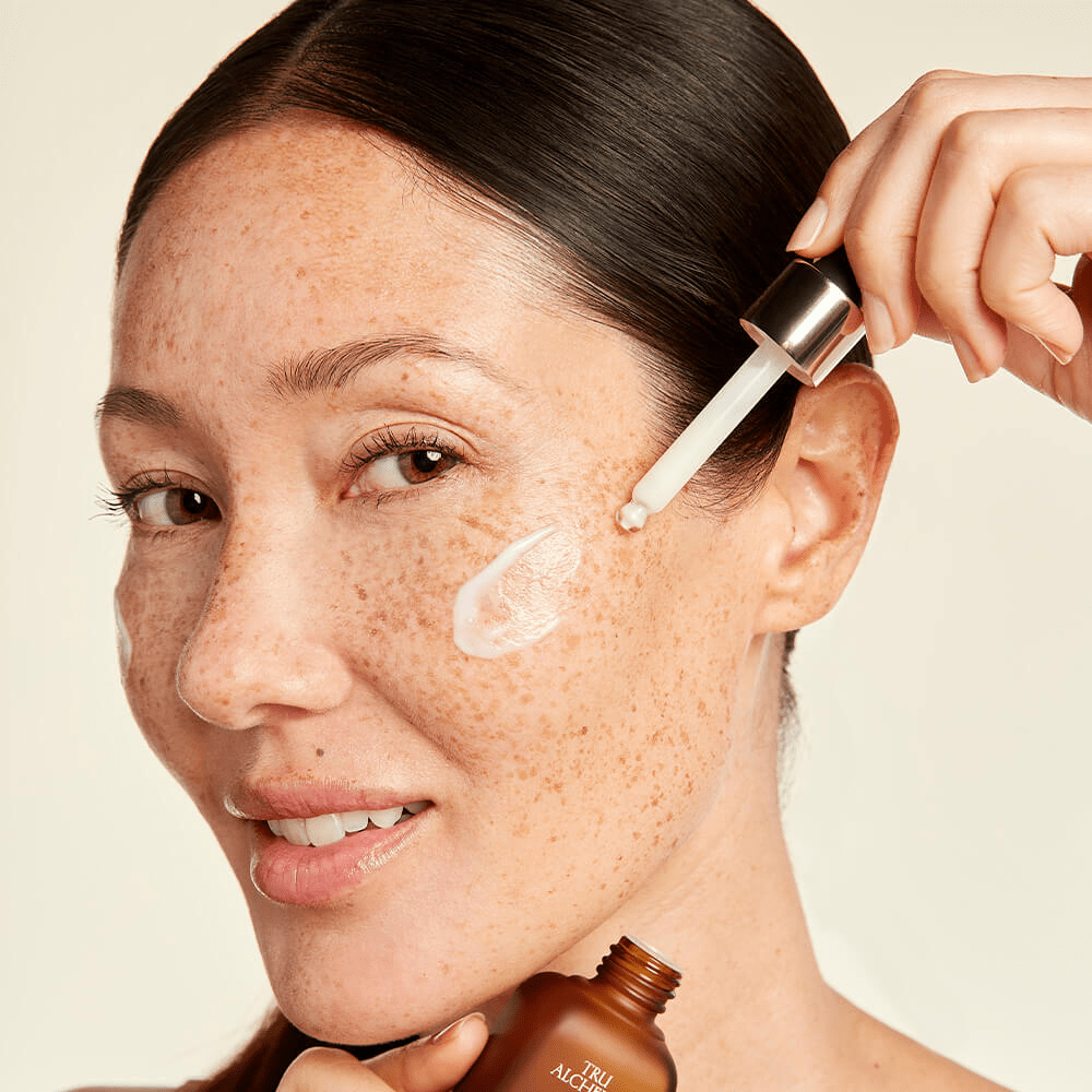 woman using Tru Alchemy&