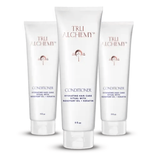 TruAlchemy Conditioner tubes with rosemary oil and keratin, featuring one larger center bottle flanked by two smaller bottles