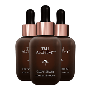 TruAlchemy Glow Serum three-bottle set with rose gold droppers and brown glass bottles