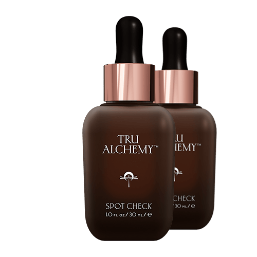 Tru Alchemy Spot Check serum, dark amber glass bottles with rose gold dropper caps, 30ml size shown as duo pair